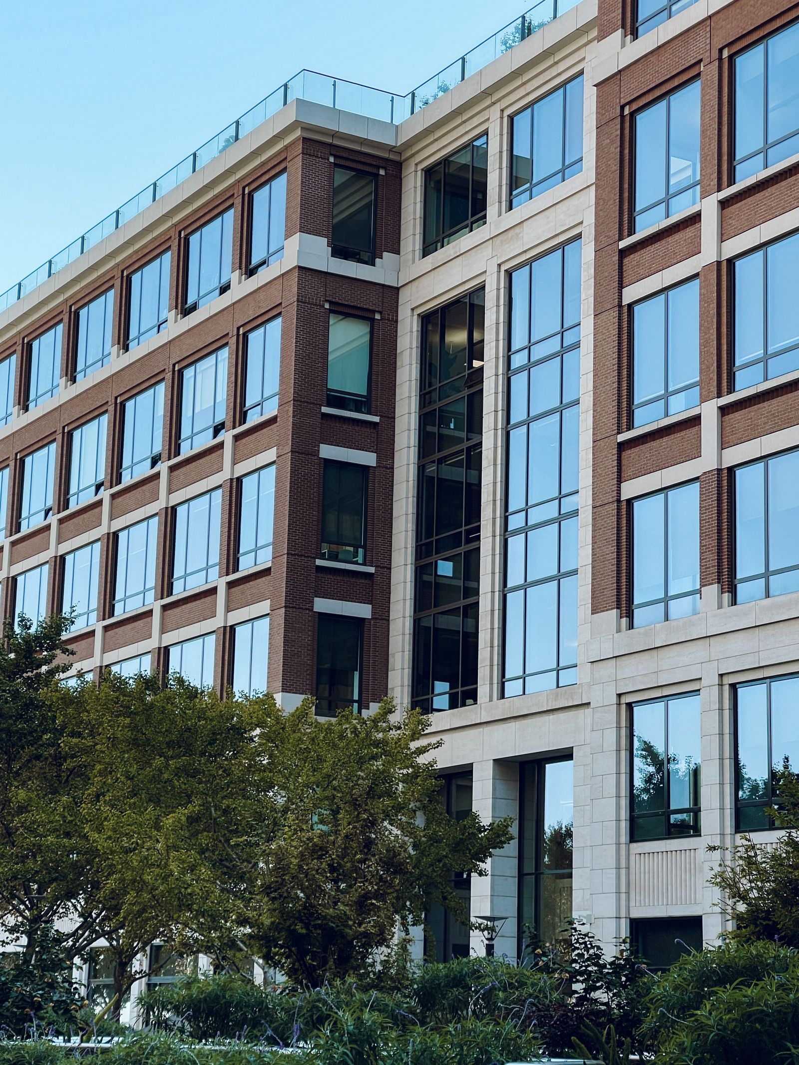 Brick and glass mixed-use building façade with tall windows